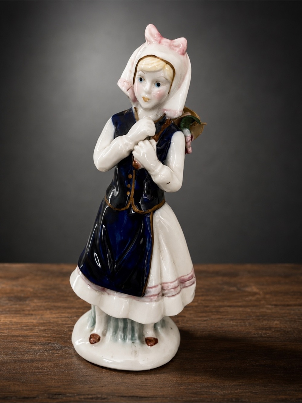 Charming Porcelain Figurine with Pink and Blue Accents